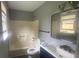 Clean bathroom with tub, toilet and updated vanity at 2073 Marbut Ln, Lithonia, GA 30058