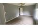 Bright bedroom with grey walls and wood-look flooring at 2073 Marbut Ln, Lithonia, GA 30058
