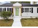 Charming white house with a green door and walkway at 194 Rosser Sw St, Atlanta, GA 30314