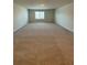 Large bonus room with carpeted floor and window at 4240 Oakhurst Dr, Fairburn, GA 30213