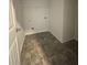 Convenient laundry room with tile flooring and shelving at 4240 Oakhurst Dr, Fairburn, GA 30213