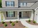 Covered front porch with black front door and brick exterior at 3479 Jasmine Way, Atlanta, GA 30331