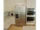 Stainless steel refrigerator and double oven in kitchen at 3479 Jasmine Way, Atlanta, GA 30331