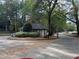 Gated community entrance with guard house at 98 De Arc Nw, Atlanta, GA 30327