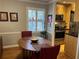 Bright dining area with wood floors and view into kitchen at 98 De Arc Nw, Atlanta, GA 30327
