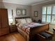Spacious bedroom with hardwood floors and a comfortable bed at 98 De Arc Nw, Atlanta, GA 30327