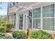 Front entrance with glass door, sidelights, shutters, and landscaping at 3247 Telford Sw Ter, Atlanta, GA 30331