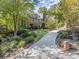 Beautiful home exterior featuring a brick facade and manicured landscaping at 7300 Chattahoochee Bluff Dr, Atlanta, GA 30350
