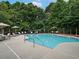 Community swimming pool with lounge chairs and umbrellas at 701 Trevett Way, Marietta, GA 30062