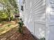 Side yard with a raised deck and wooded area at 2654 Calumet Farm Ln, Snellville, GA 30039