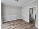 Bright dining room with hardwood floors and view into kitchen at 2654 Calumet Farm Ln, Snellville, GA 30039