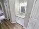 Bathroom with granite countertop, white cabinets and a mirror at 2654 Calumet Farm Ln, Snellville, GA 30039