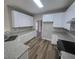 Modern kitchen with white cabinets and granite countertops at 2654 Calumet Farm Ln, Snellville, GA 30039