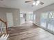 Open living room and kitchen with hardwood floors and access to deck at 2654 Calumet Farm Ln, Snellville, GA 30039