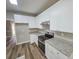Modern kitchen with white cabinets and granite countertops at 2654 Calumet Farm Ln, Snellville, GA 30039
