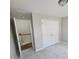 Bedroom with double closets and access to upstairs hallway at 2654 Calumet Farm Ln, Snellville, GA 30039