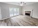Living room with hardwood floors, fireplace, and access to deck at 2654 Calumet Farm Ln, Snellville, GA 30039
