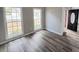 Bright living room with hardwood floors and large windows at 2654 Calumet Farm Ln, Snellville, GA 30039