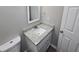 Bathroom with granite countertop vanity and white toilet at 2654 Calumet Farm Ln, Snellville, GA 30039
