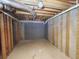 Unfinished basement with high ceilings and ample storage potential at 2654 Calumet Farm Ln, Snellville, GA 30039