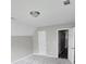 Spacious bedroom with neutral walls, carpet flooring, and an adjacent hallway at 2654 Calumet Farm Ln, Snellville, GA 30039