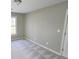 Bright bedroom with neutral walls, carpet flooring, and a large window at 2654 Calumet Farm Ln, Snellville, GA 30039
