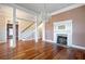 Elegant dining room features hardwood floors, a fireplace, and a crystal chandelier at 4409 Shiloh Rd, Loganville, GA 30052