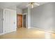 Large bedroom with light grey walls and wood flooring at 4409 Shiloh Rd, Loganville, GA 30052