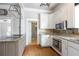 Modern kitchen with granite countertops and stainless steel appliances at 4409 Shiloh Rd, Loganville, GA 30052