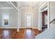 Bright entryway with hardwood floors and stained glass door at 4409 Shiloh Rd, Loganville, GA 30052
