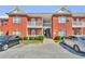 Brick apartment building with balconies and parking at 7712 Autry Cir # 7-721, Douglasville, GA 30134