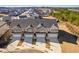 An aerial perspective of the townhomes and surrounding neighborhood at 835 Pensive Run, Dacula, GA 30019