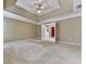 Main bedroom with carpet, ceiling fan, and bathroom access at 8615 Amsbury Way, Cumming, GA 30041