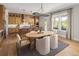 Spacious kitchen with an island, wood cabinets, and a dining area at 5063 Baywood Ln, Woodstock, GA 30188