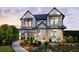 Two-story home with gray siding, landscaping, and a walkway at 5063 Baywood Ln, Woodstock, GA 30188