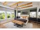 Spacious bedroom with a large bed, wood beams and a green accent wall at 5063 Baywood Ln, Woodstock, GA 30188