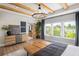 Main bedroom with hardwood floors, exposed beams and large windows at 5063 Baywood Ln, Woodstock, GA 30188