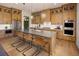 Modern kitchen with gray countertops, wood cabinets, and stainless steel appliances at 5063 Baywood Ln, Woodstock, GA 30188