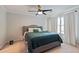 Spacious main bedroom with ceiling fan and plush carpet at 4131 High Park Terrace, Atlanta, GA 30344