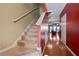 Inviting entryway with hardwood floors and carpeted stairs at 4131 High Park Terrace, Atlanta, GA 30344