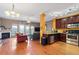 Open concept kitchen with stainless steel appliances and wood cabinets at 4131 High Park Terrace, Atlanta, GA 30344