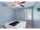 Bright bedroom with ceiling fan and neutral color scheme at 4131 High Park Terrace, Atlanta, GA 30344
