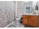 Full bathroom with shower/tub combo and wood vanity at 4131 High Park Terrace, Atlanta, GA 30344