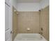 Clean bathroom with shower/tub combo and tile surround at 4004 Wingate Way, Atlanta, GA 30350