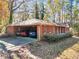 Brick ranch house with carport and landscaping at 10215 Alvin Rd, Alpharetta, GA 30022