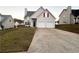 Two-story house with two-car garage and landscaped lawn at 137 St Ann Cir, Dallas, GA 30157