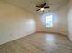 Bright bedroom featuring a ceiling fan and large window at 137 St Ann Cir, Dallas, GA 30157