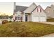 Two-story house with two-car garage and landscaped lawn at 137 St Ann Cir, Dallas, GA 30157