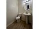 Small bathroom with pedestal sink and a white toilet at 137 St Ann Cir, Dallas, GA 30157