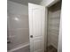 Bathroom with a tub and linen closet at 137 St Ann Cir, Dallas, GA 30157